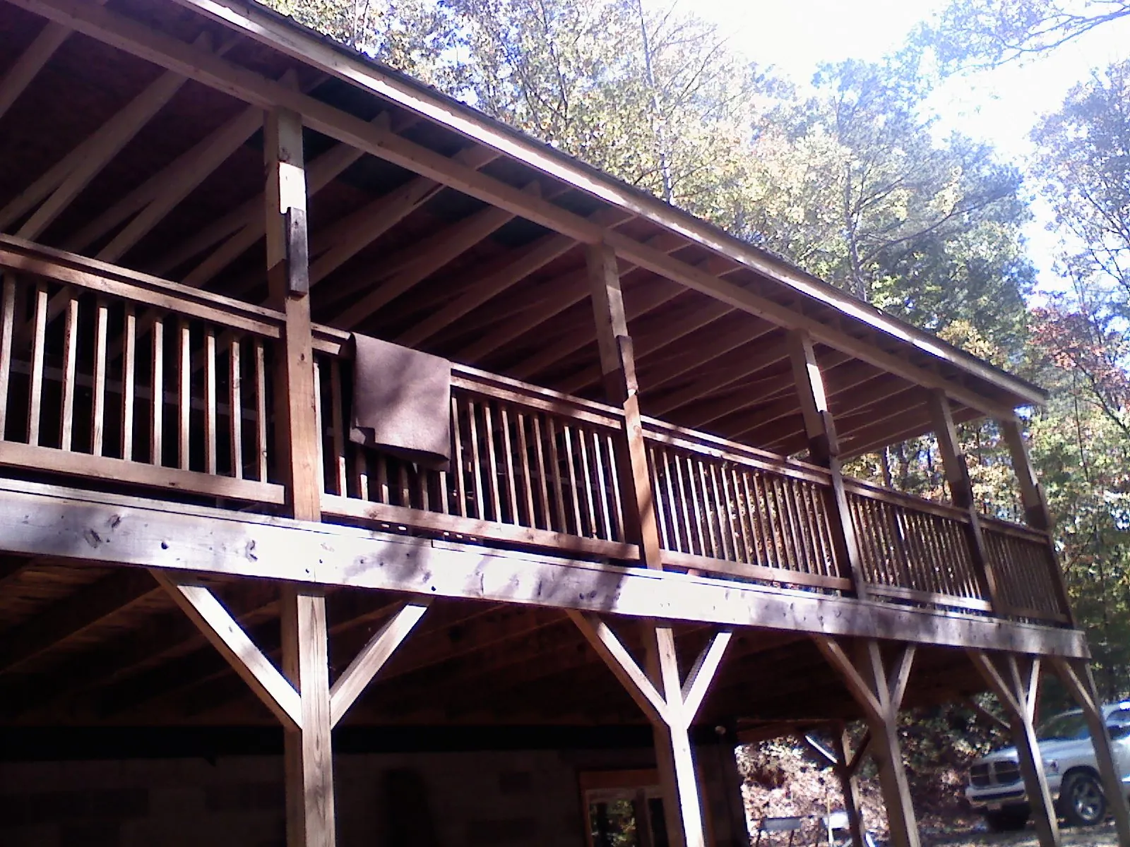 Timber framing under a new elevated porch and deck — Roof Leak Repair in Portis by Roofing Brothers